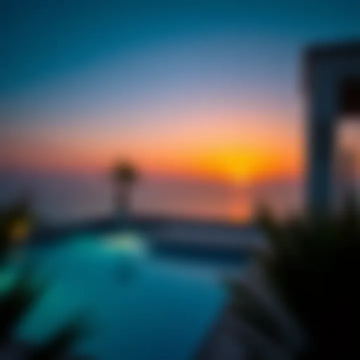 A stunning sunset view from a villa with a private pool