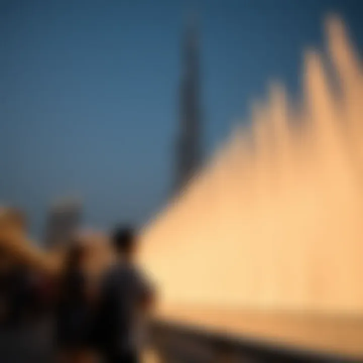Visitors at Burj Khalifa Fountain Visitors enjoying the Burj Khalifa Fountain show with the iconic tower in the background