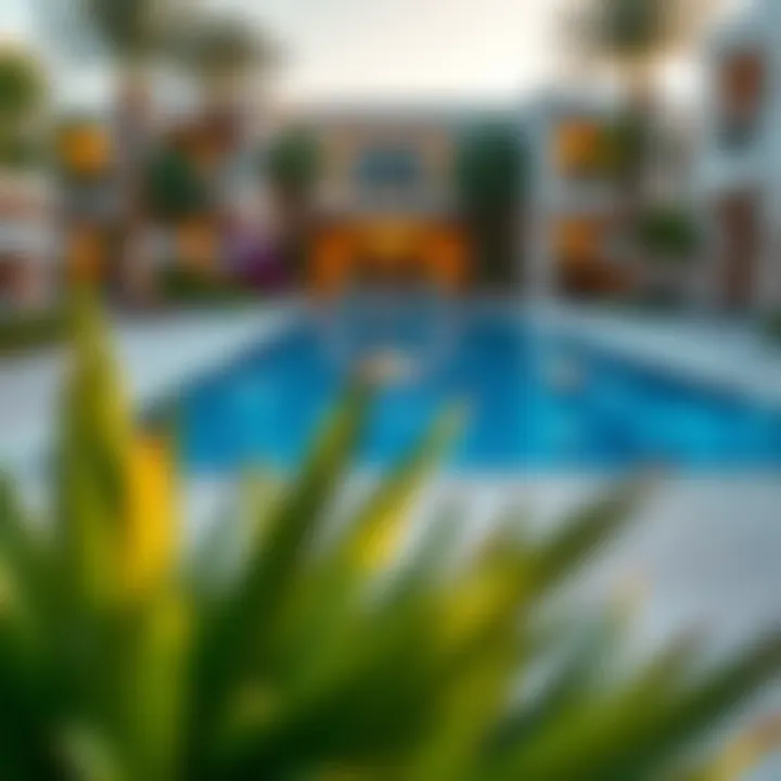 Vibrant outdoor pool area surrounded by lush landscaping at Sarai Villas