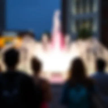 Visitors enjoying the fountain's display, capturing moments of joy and wonder