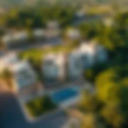 Aerial view of Tilal Ghaf showcasing its lush greenery and luxurious villas